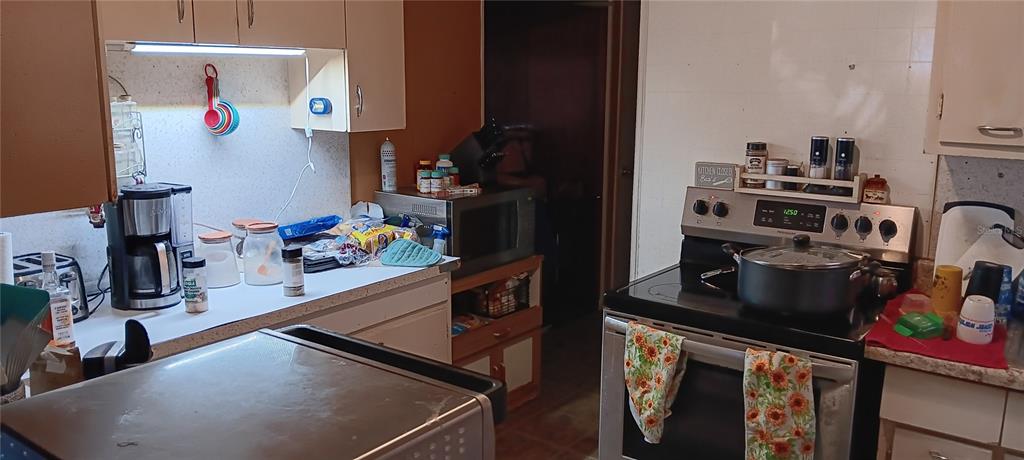 555 Lee Road Jacksonville, FL 32225 - Photo 47 of 67 a kitchen with refrigerator and stove