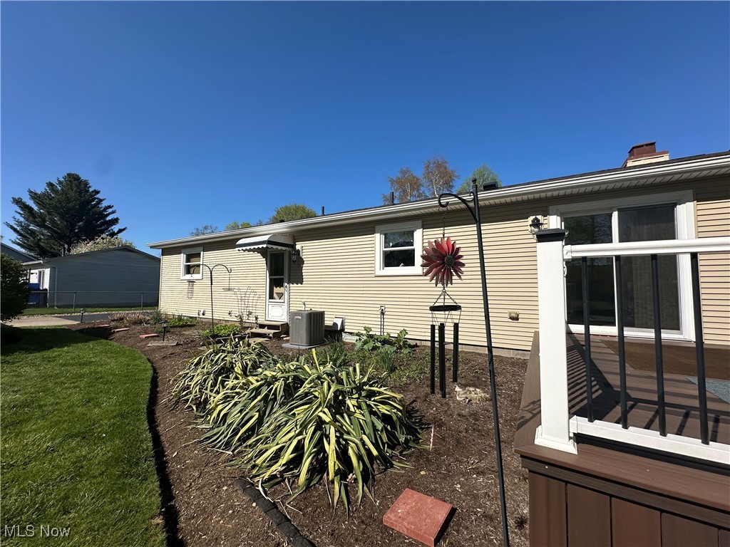 157 Birch Road Painesville, OH 44077 - Photo 28 of 41 Rear view of house with central AC unit