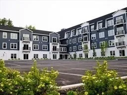 a front view of a building with street view