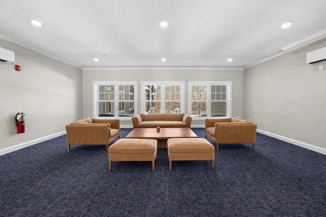 a bed room with couch and a window