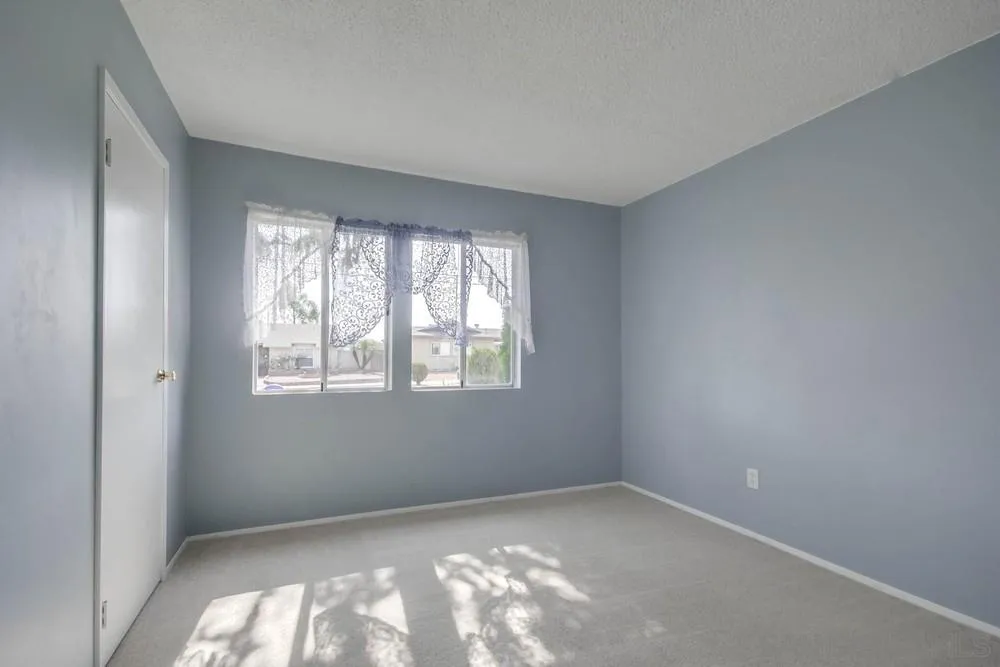 9464 Stoyer Drive Santee, CA 92071 - Photo 13 of 25 an empty room with a window