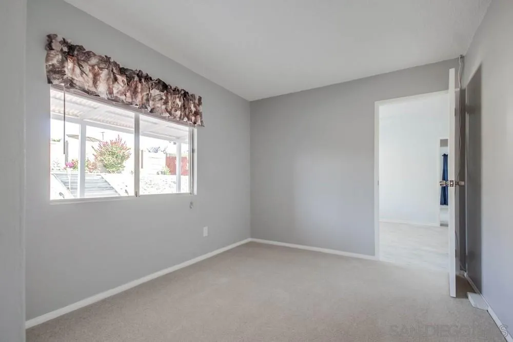 9464 Stoyer Drive Santee, CA 92071 - Photo 17 of 25 a view of an empty room with a window