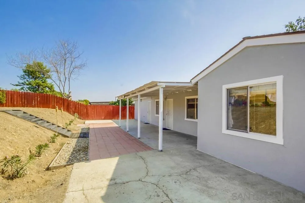 9464 Stoyer Drive Santee, CA 92071 - Photo 22 of 25 front view of a house with a yard