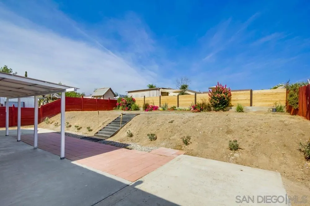 9464 Stoyer Drive Santee, CA 92071 - Photo 24 of 25 a bedroom with a bed and a night stand