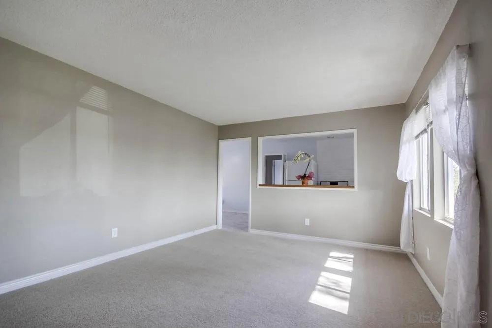 9464 Stoyer Drive Santee, CA 92071 - Photo 5 of 25 a view of an empty room with a window