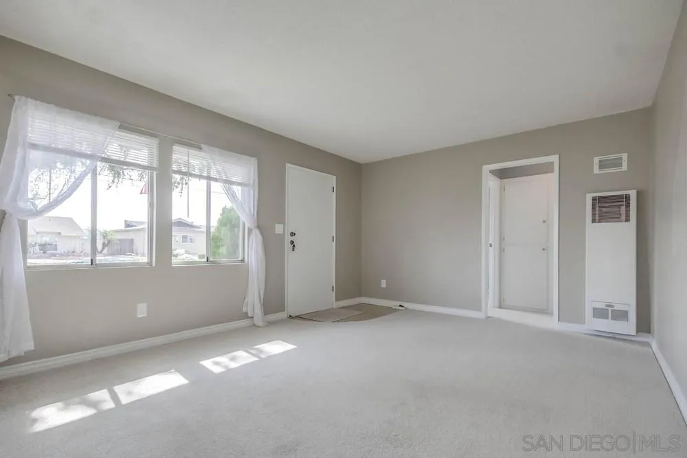 9464 Stoyer Drive Santee, CA 92071 - Photo 6 of 25 a view of an empty room with a window