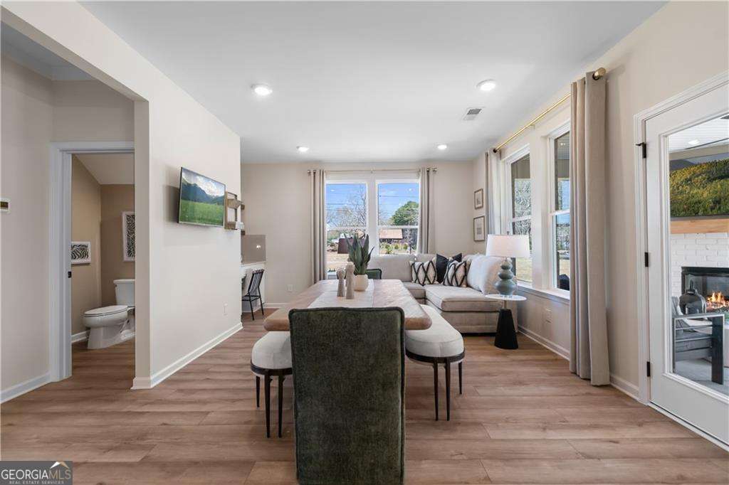 420 Hartsfield Road McDonough, GA 30253 - Photo 12 of 44 a living room with furniture and a wooden floor