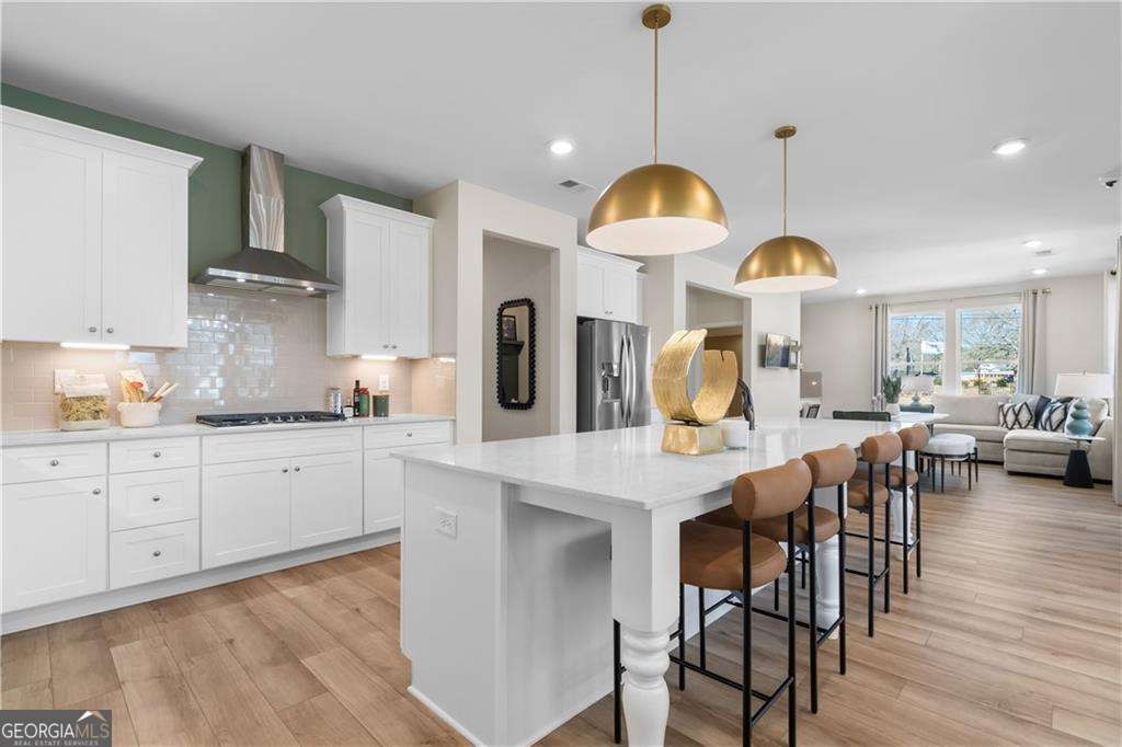 420 Hartsfield Road McDonough, GA 30253 - Photo 18 of 44 a view of a kitchen with cabinets and wooden floor