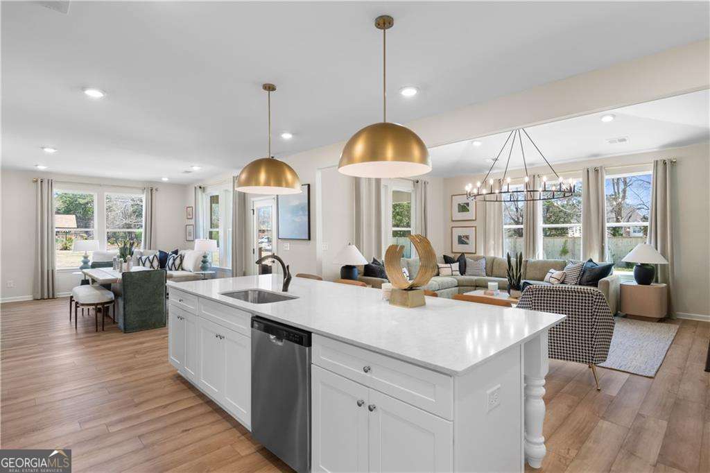 420 Hartsfield Road McDonough, GA 30253 - Photo 19 of 44 a view of living room with granite countertop furniture and a chandelier