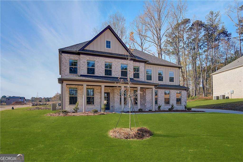 420 Hartsfield Road McDonough, GA 30253 - Photo 2 of 44 front view of a house with a yard