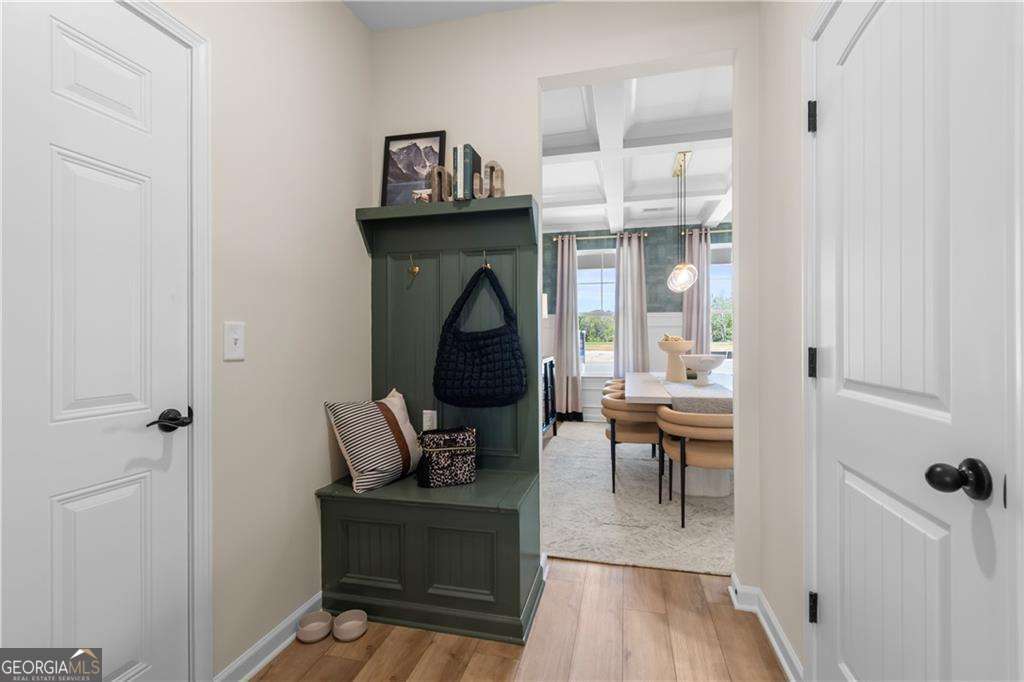 420 Hartsfield Road McDonough, GA 30253 - Photo 24 of 44 a living room with furniture a wooden floor and a fireplace