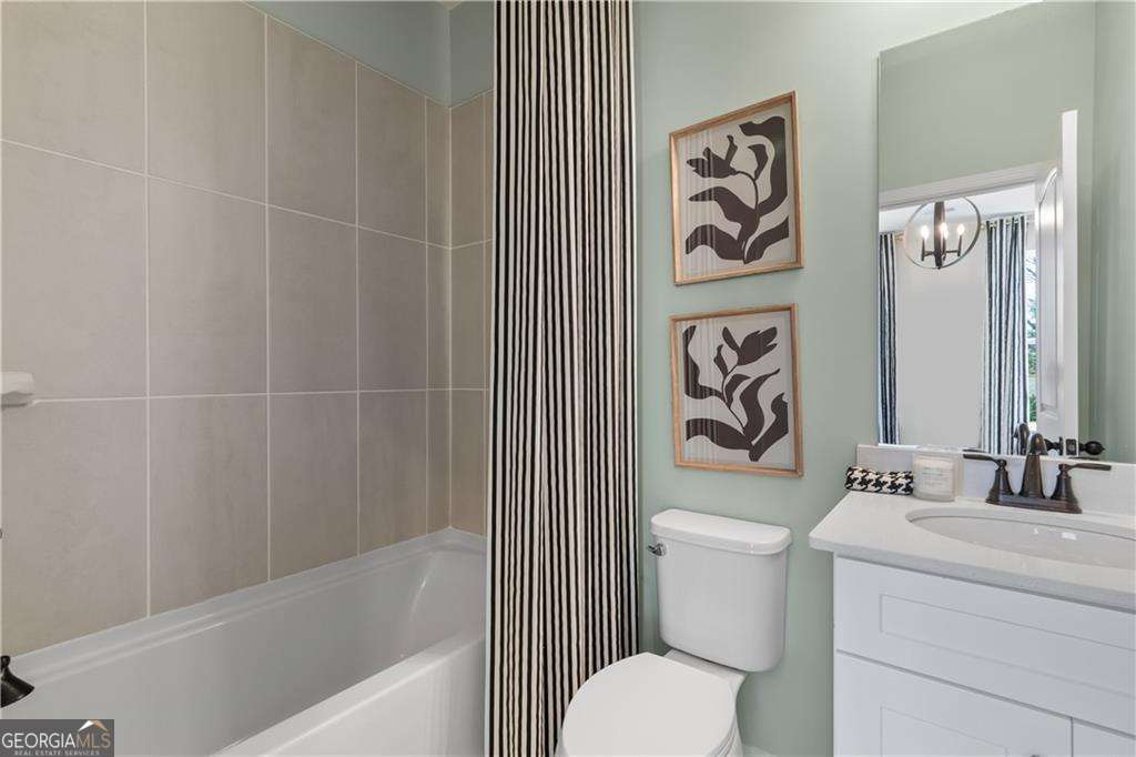 420 Hartsfield Road McDonough, GA 30253 - Photo 27 of 44 a bathroom with a sink a toilet and a bathtub