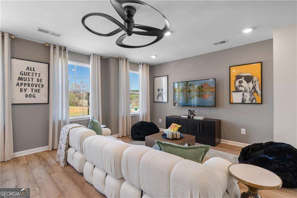 420 Hartsfield Road McDonough, GA 30253 - Photo 29 of 44 a living room with furniture and a large window