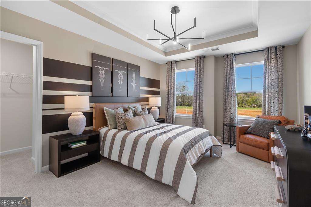 420 Hartsfield Road McDonough, GA 30253 - Photo 31 of 44 a bedroom with a bed couches and wooden floor