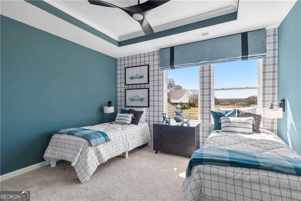 420 Hartsfield Road McDonough, GA 30253 - Photo 34 of 44 a bedroom with a bed couch and a large window