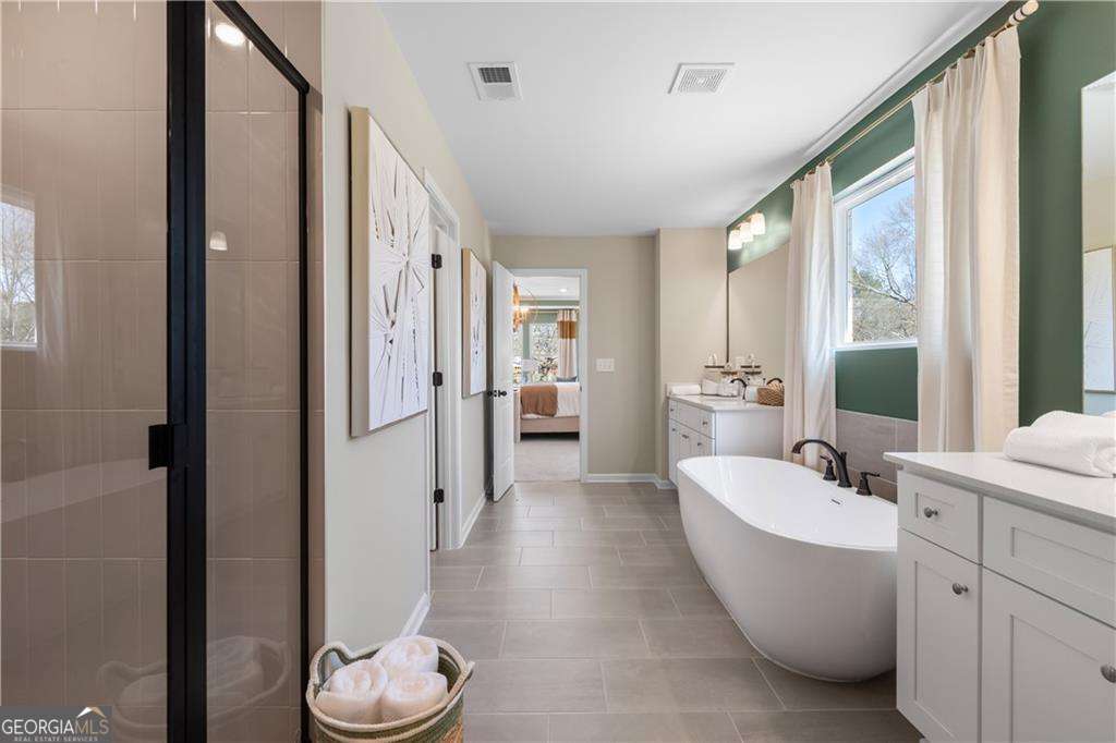 420 Hartsfield Road McDonough, GA 30253 - Photo 43 of 44 a bathroom with a bathtub and a sink