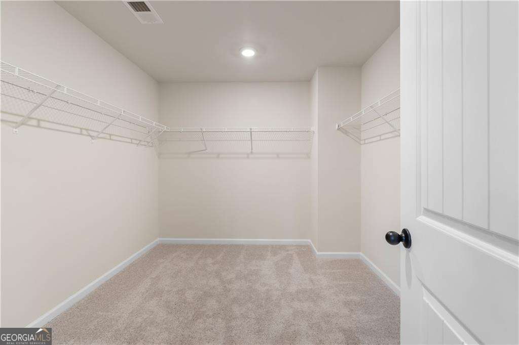 420 Hartsfield Road McDonough, GA 30253 - Photo 44 of 44 a view of a room with racks on the wall