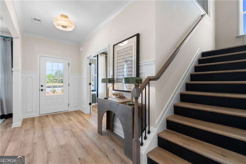 420 Hartsfield Road McDonough, GA 30253 - Photo 9 of 44 a view of entryway with wooden floor and stairs