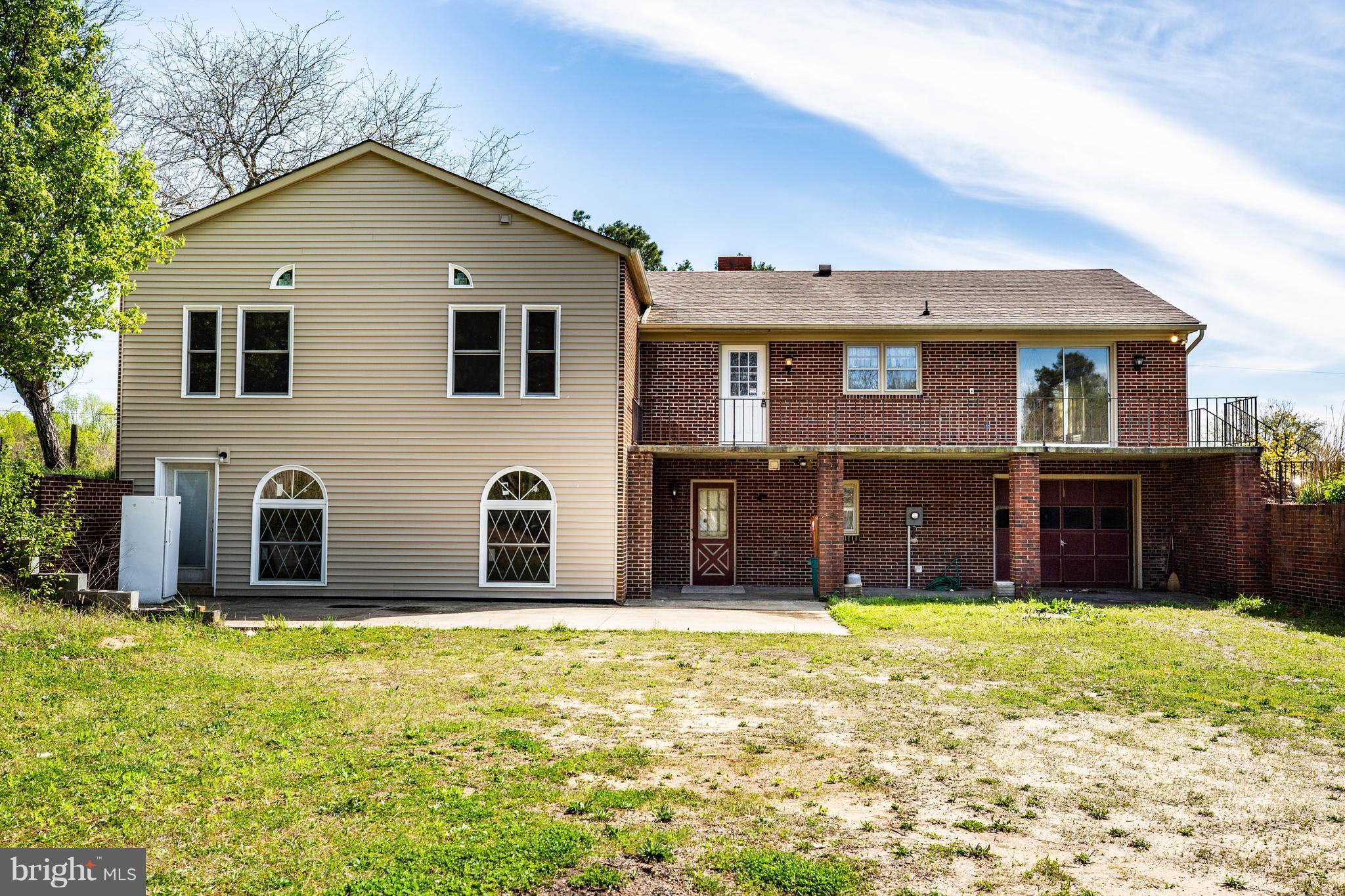 16195 Ridge Road King George, VA 22485 - Photo 3 of 29 Back of home with porch and drive under garage