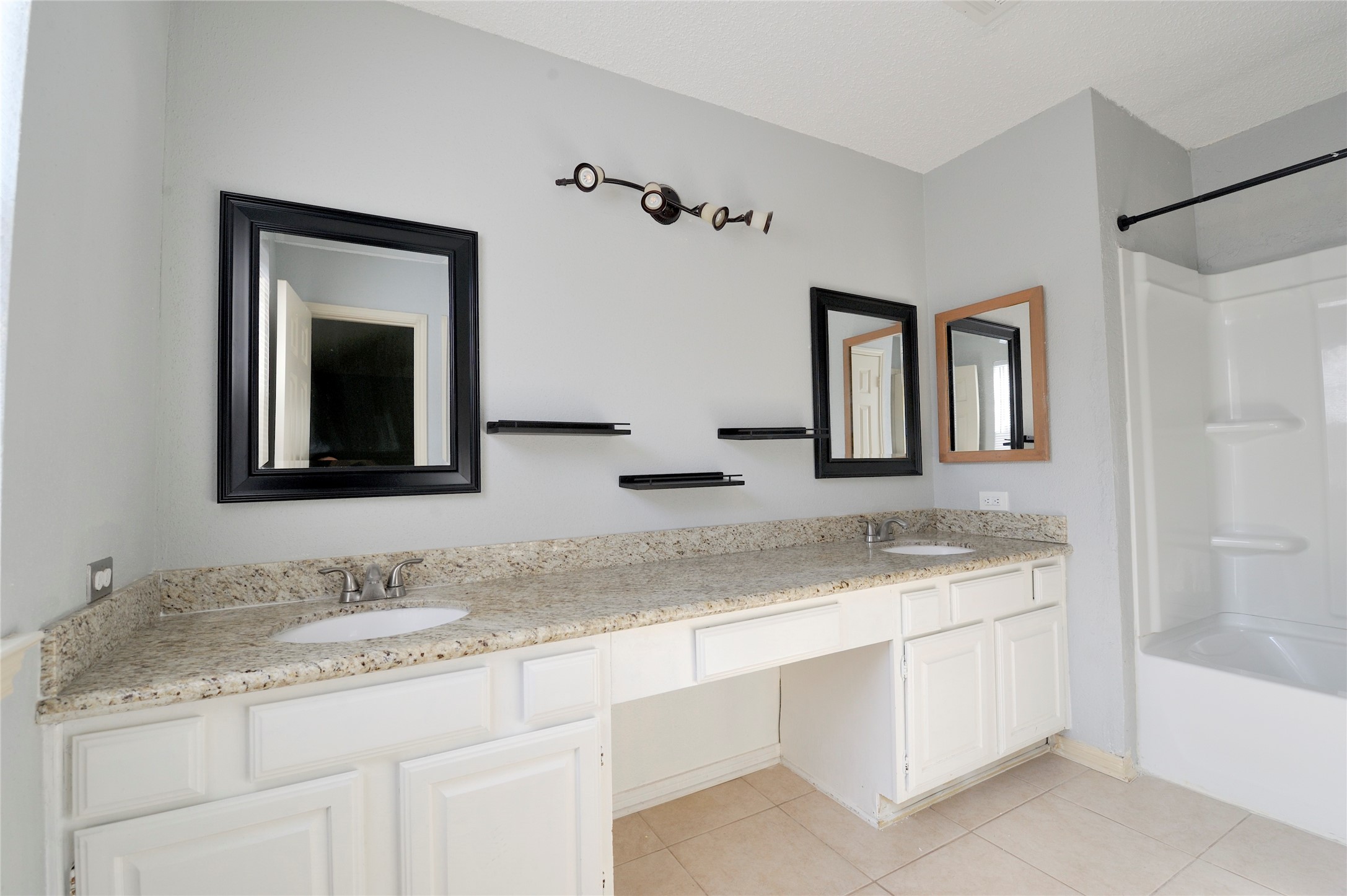 3219 Pecan Draw Court Sugar Land, TX 77479 - Photo 12 of 20 a bathroom with a granite countertop sink vanity and mirror