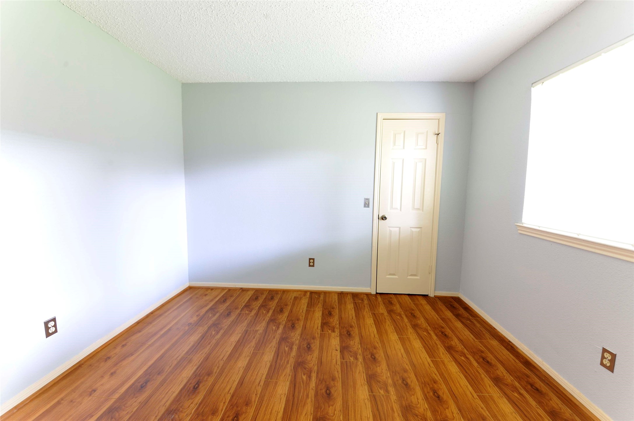 3219 Pecan Draw Court Sugar Land, TX 77479 - Photo 14 of 20 an empty room with wooden floor and windows