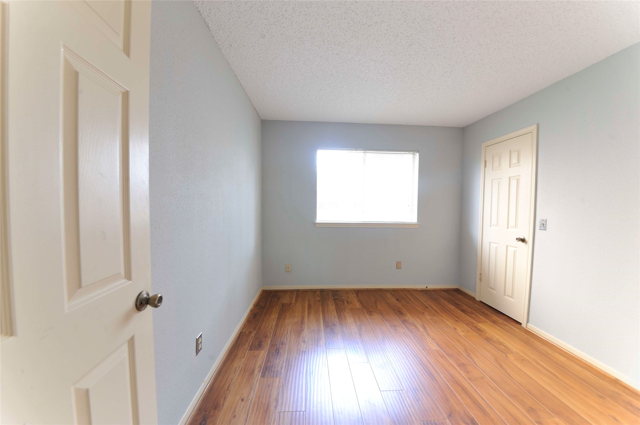 3219 Pecan Draw Court Sugar Land, TX 77479 - Photo 15 of 20 an empty room with wooden floor and windows