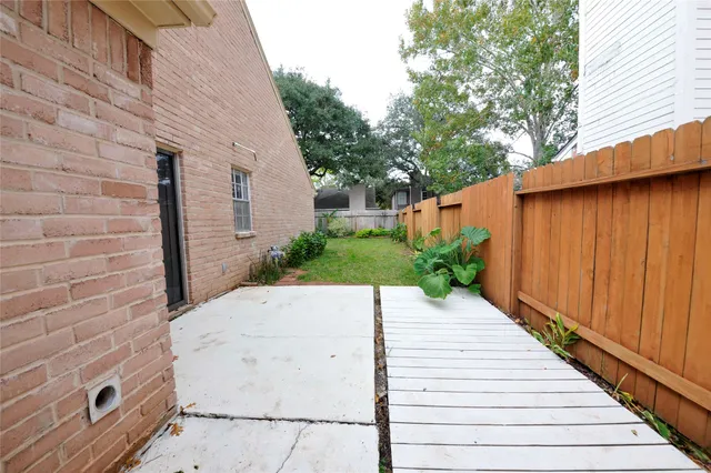 a view of a backyard of the house