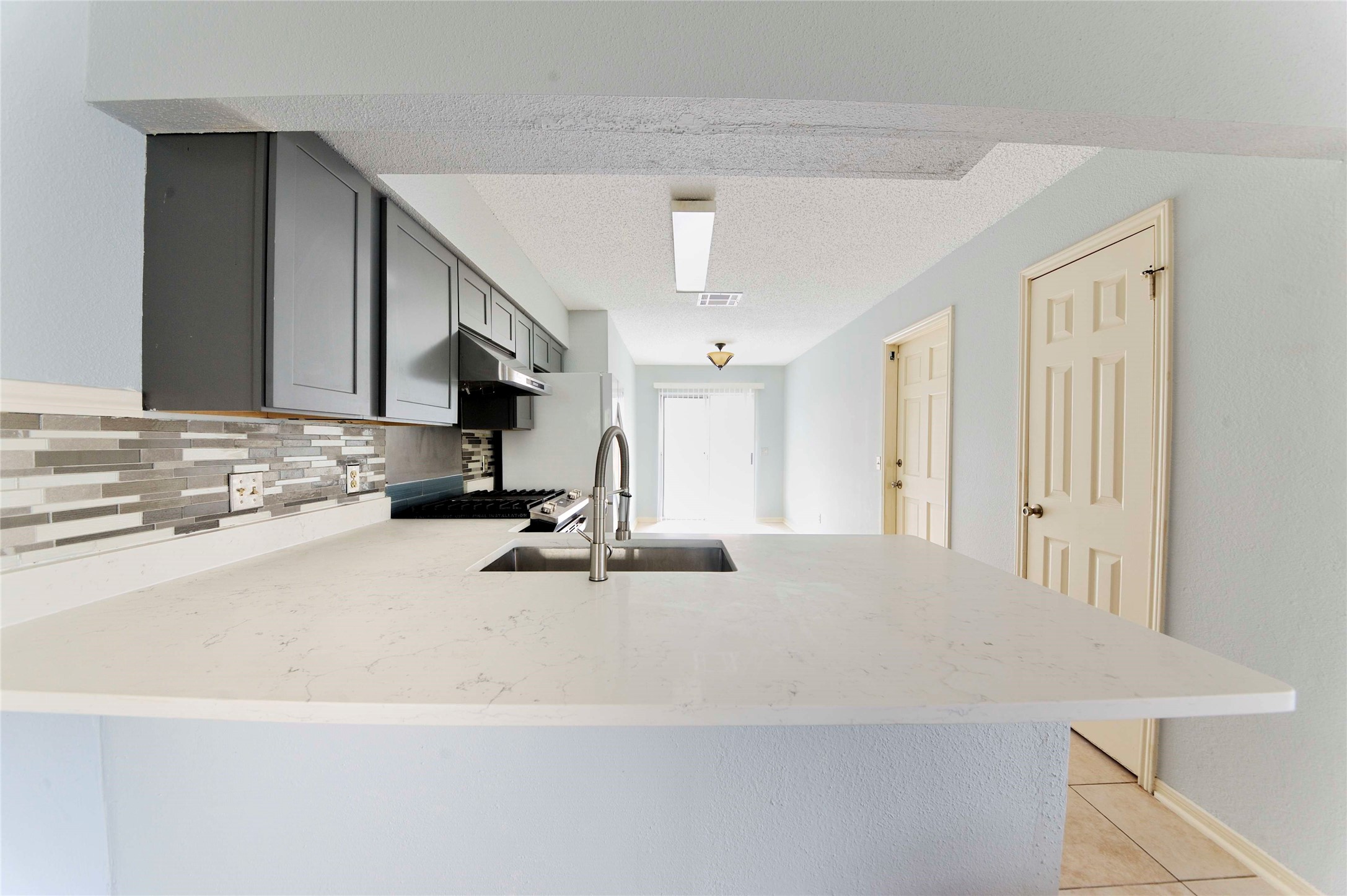 3219 Pecan Draw Court Sugar Land, TX 77479 - Photo 6 of 20 a kitchen with stainless steel appliances a sink and a stove