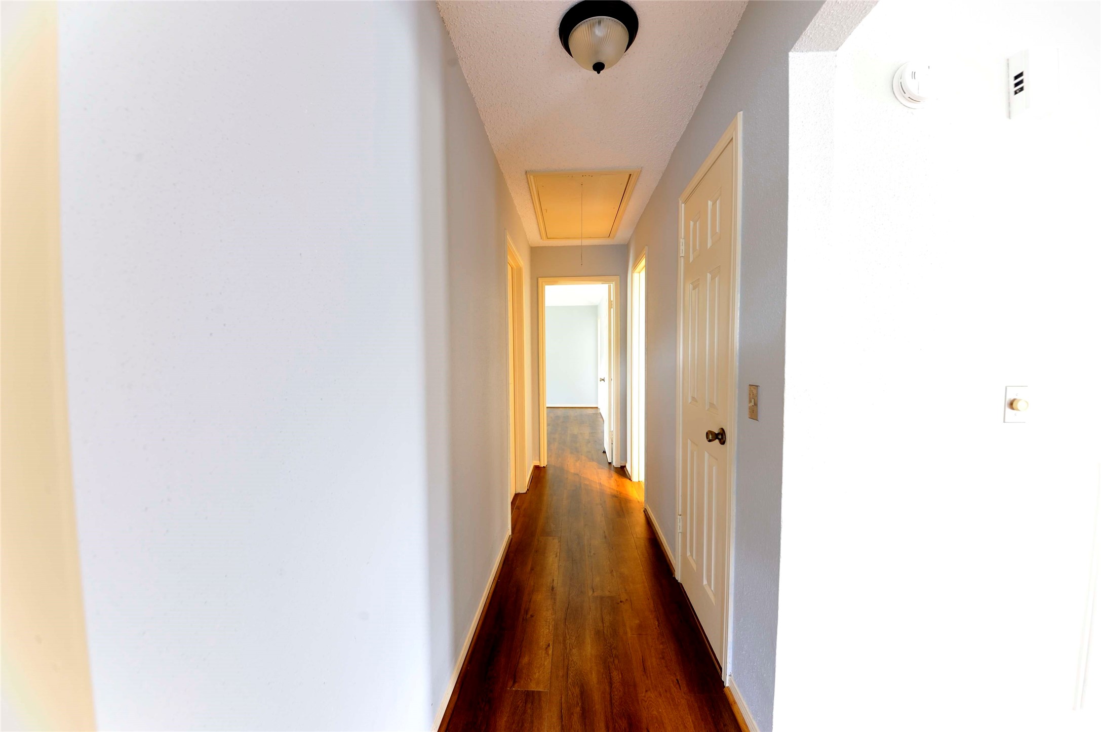 3219 Pecan Draw Court Sugar Land, TX 77479 - Photo 9 of 20 a view of a hallway with wooden floor