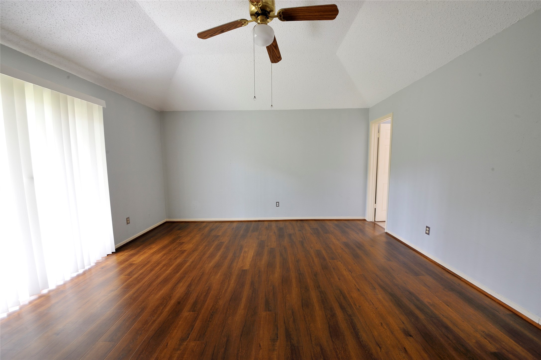 3219 Pecan Draw Court Sugar Land, TX 77479 - Photo 10 of 20 an empty room with a hardwood and ceiling fan