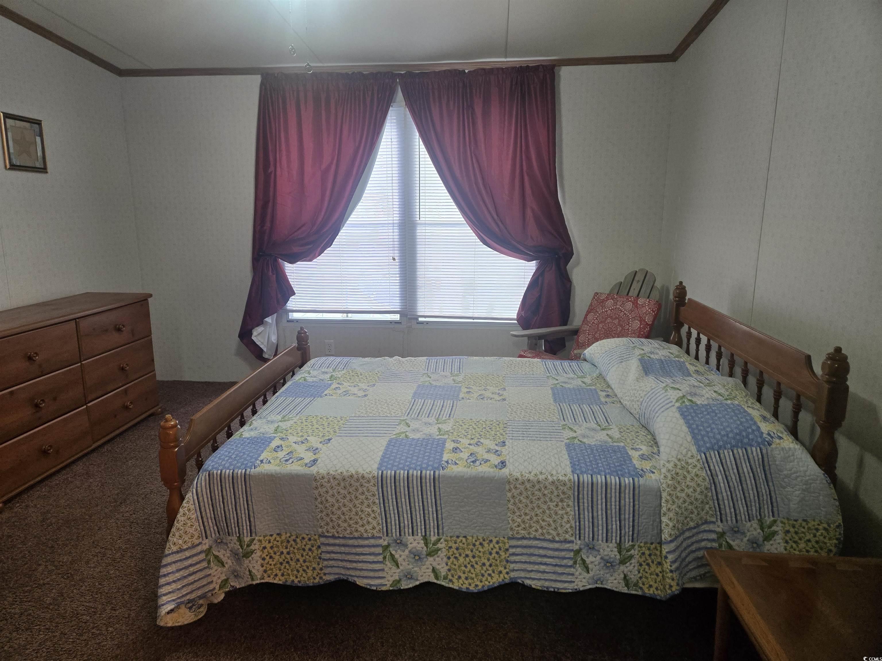 326 Tunnoch Road Murrells Inlet, SC 29576 - Photo 16 of 22 Bedroom featuring crown molding and carpet floors