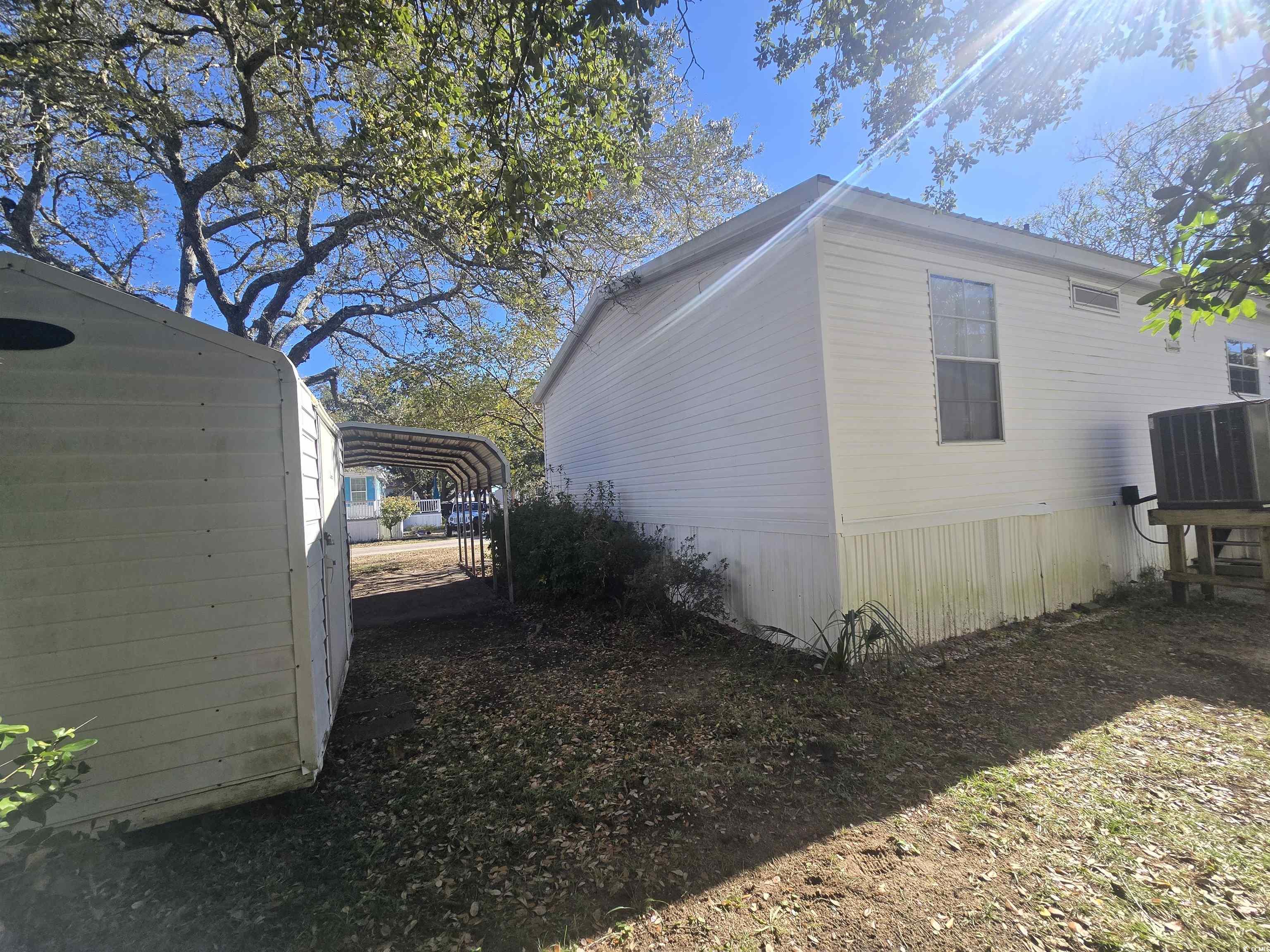 326 Tunnoch Road Murrells Inlet, SC 29576 - Photo 5 of 22 View of side of home featuring a cooling unit