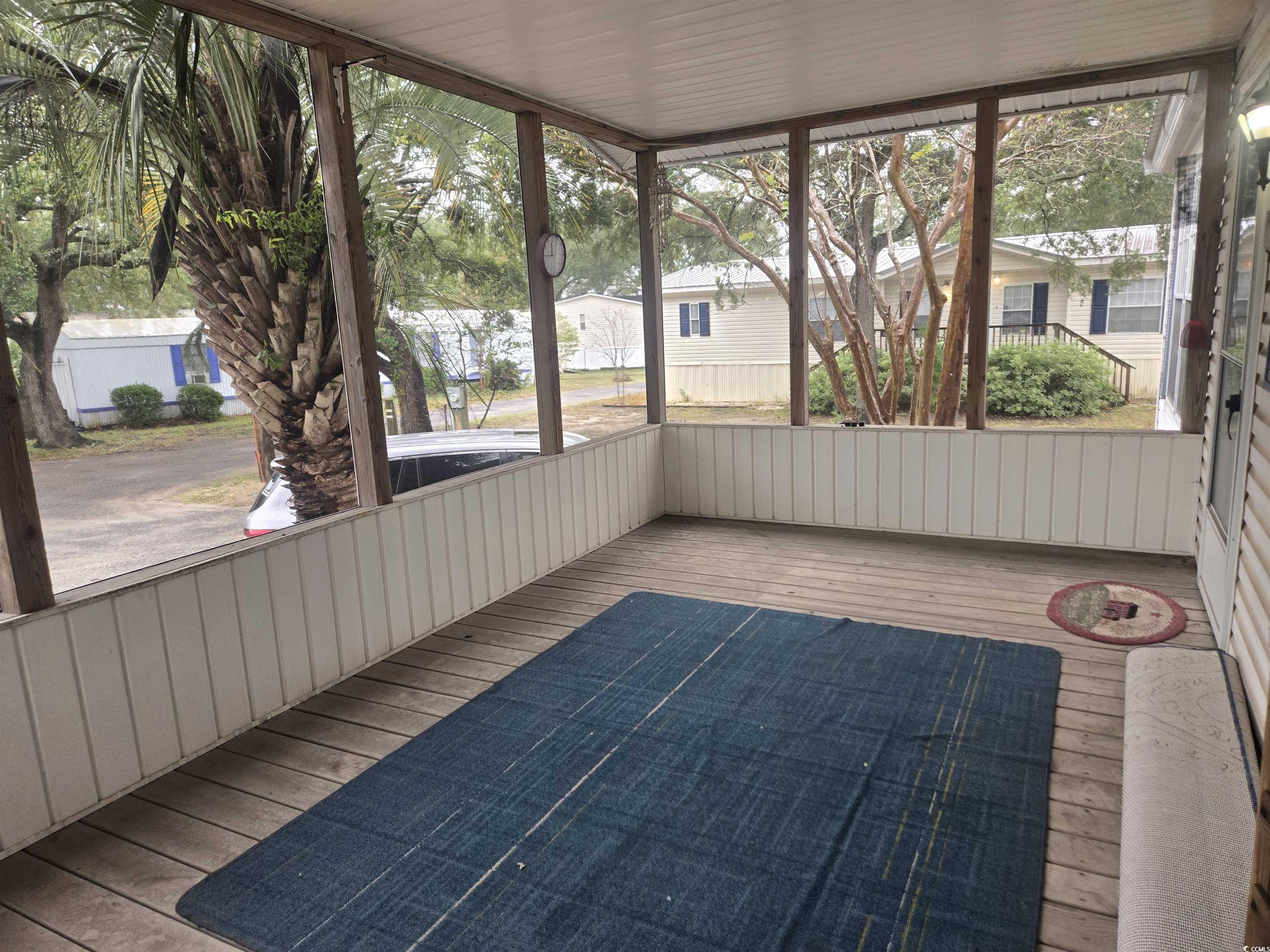 326 Tunnoch Road Murrells Inlet, SC 29576 - Photo 7 of 22 Unfurnished sunroom featuring hardwood / wood-style floors and plenty of natural light