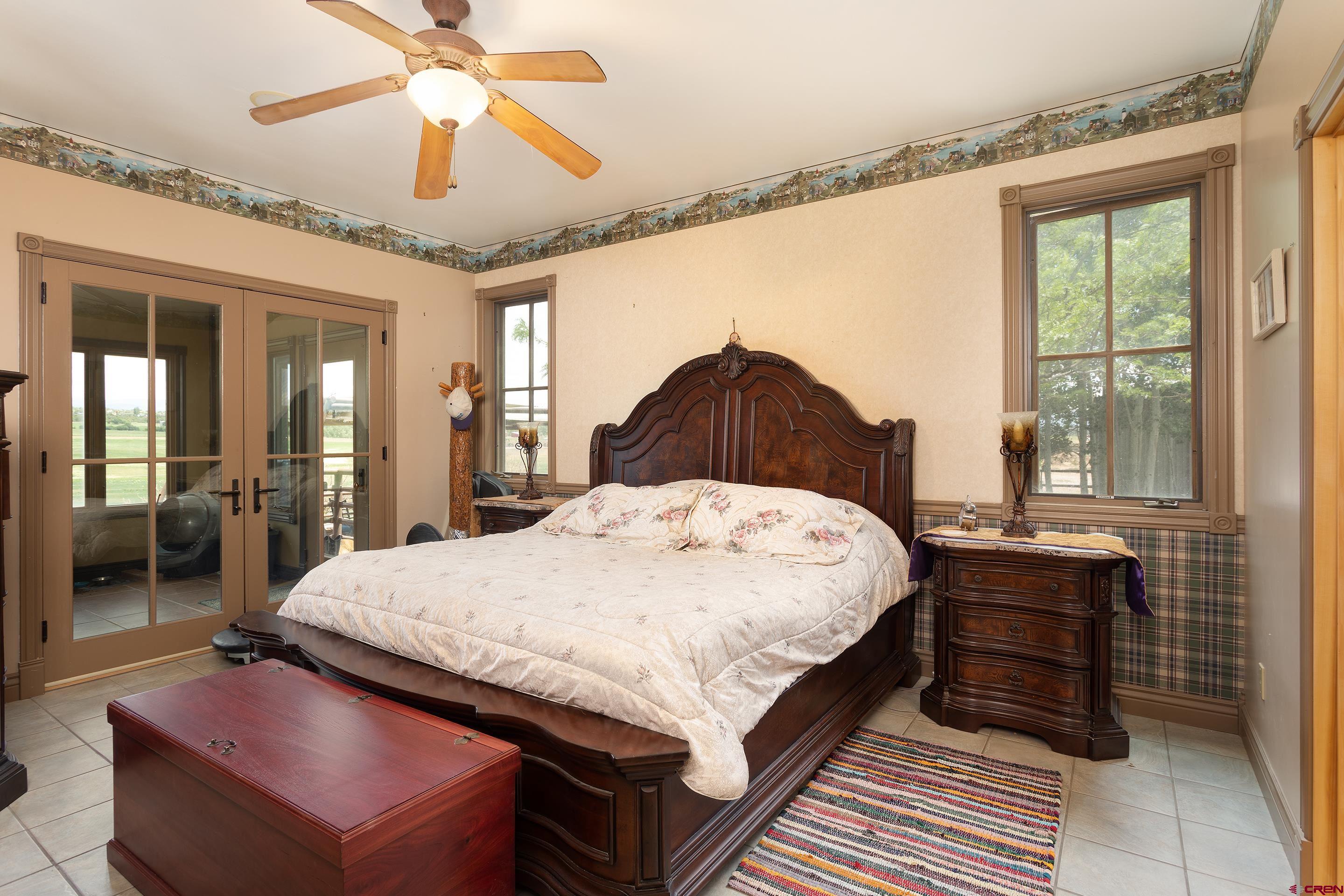 1747 County Road 514 Ignacio, CO 81137 - Photo 15 of 35 a bed sitting in a spacious bedroom next to a window