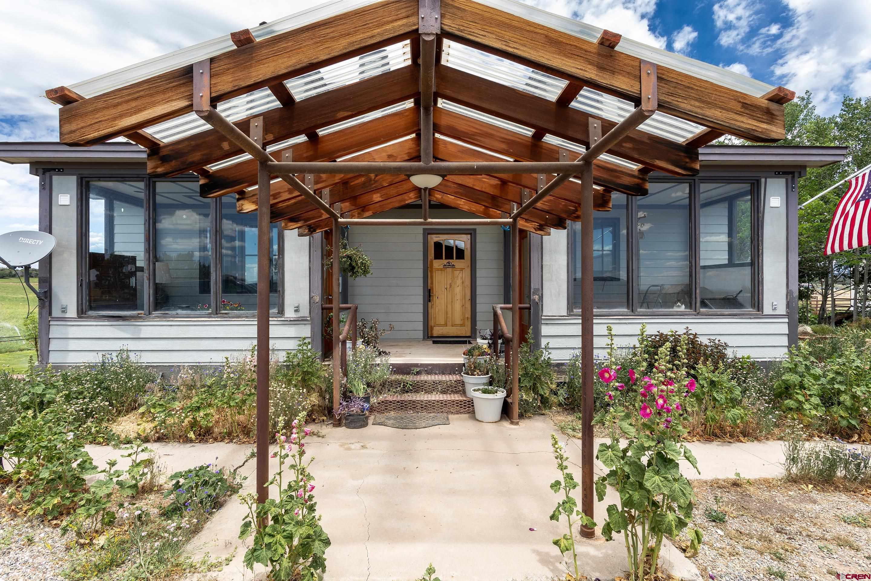 1747 County Road 514 Ignacio, CO 81137 - Photo 3 of 35 a view of a porch with a bench