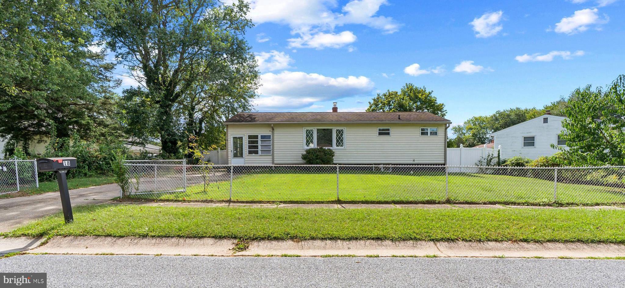 18 John Collins Circle Dover, DE 19904 - Photo 1 of 17 a front view of a house with a garden