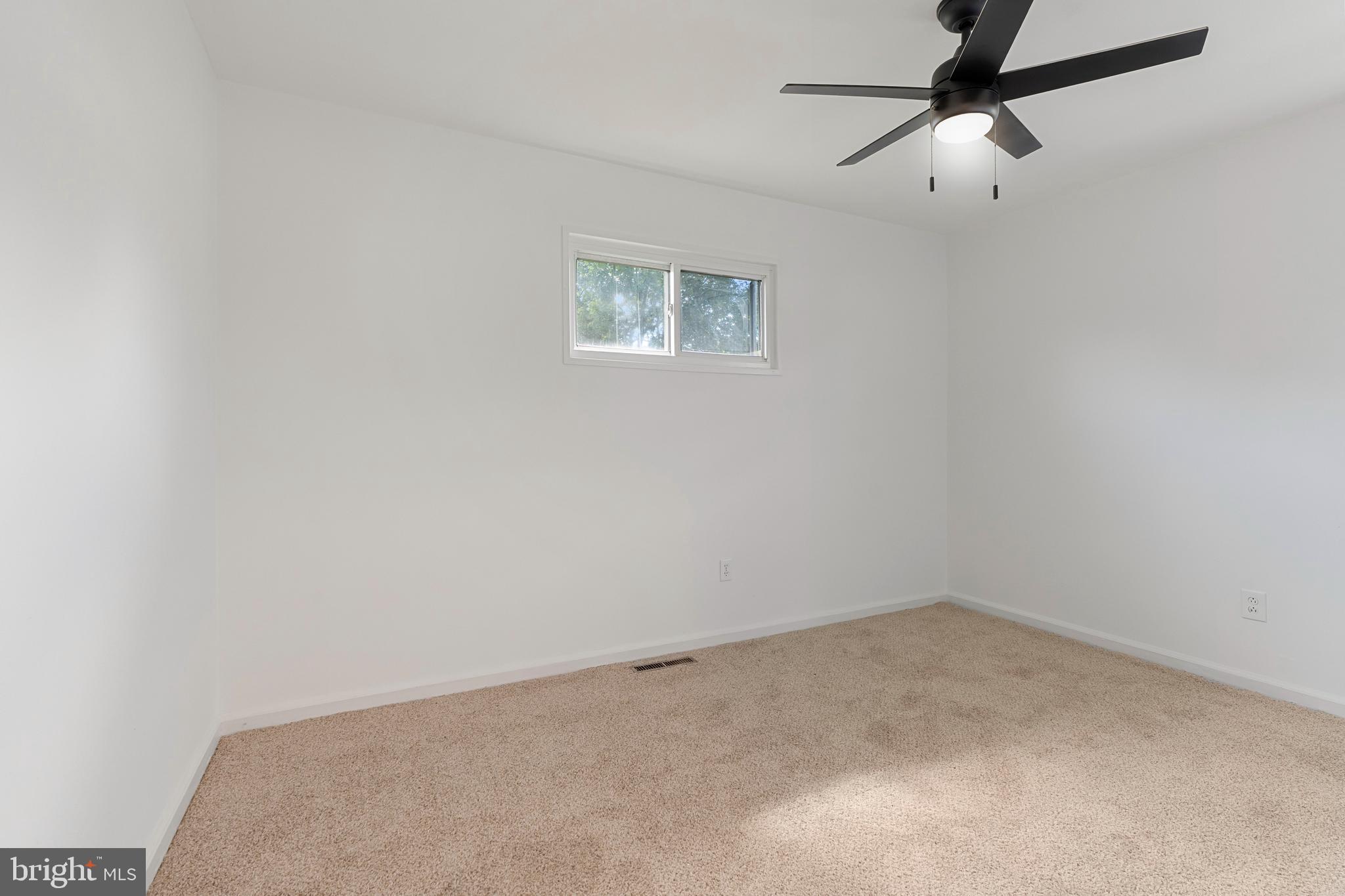 18 John Collins Circle Dover, DE 19904 - Photo 11 of 17 an empty room with a window