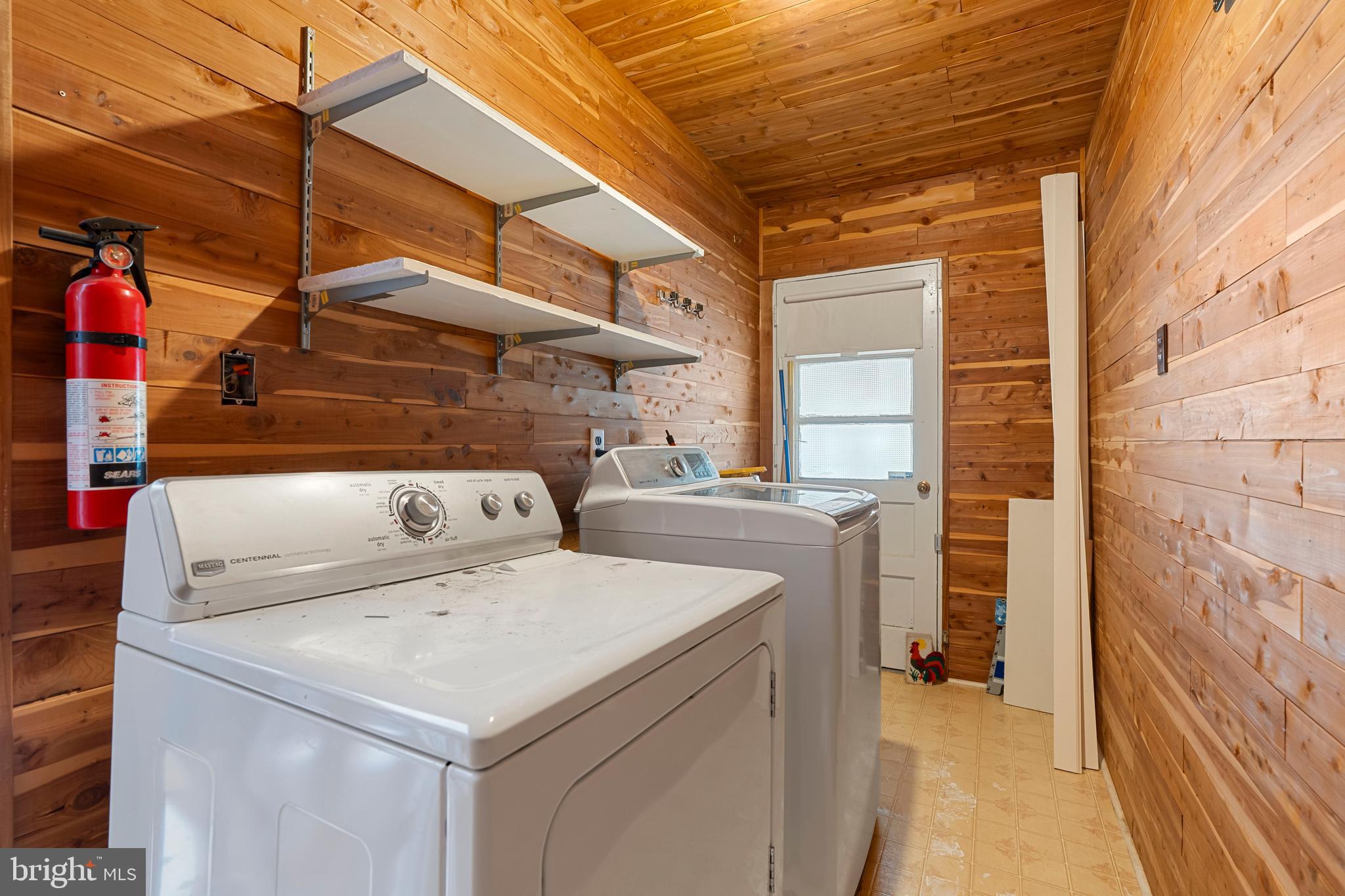 18 John Collins Circle Dover, DE 19904 - Photo 15 of 17 a utility room with dryer and washer