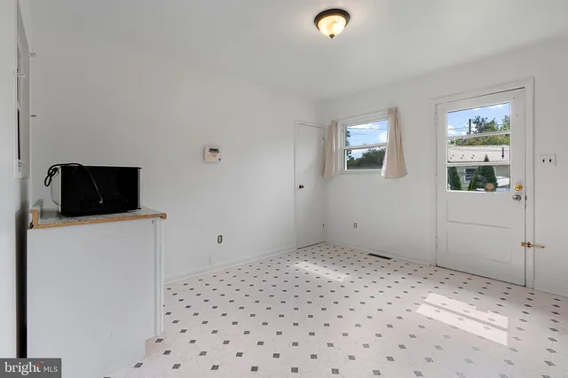 a bedroom with a bed and a tv