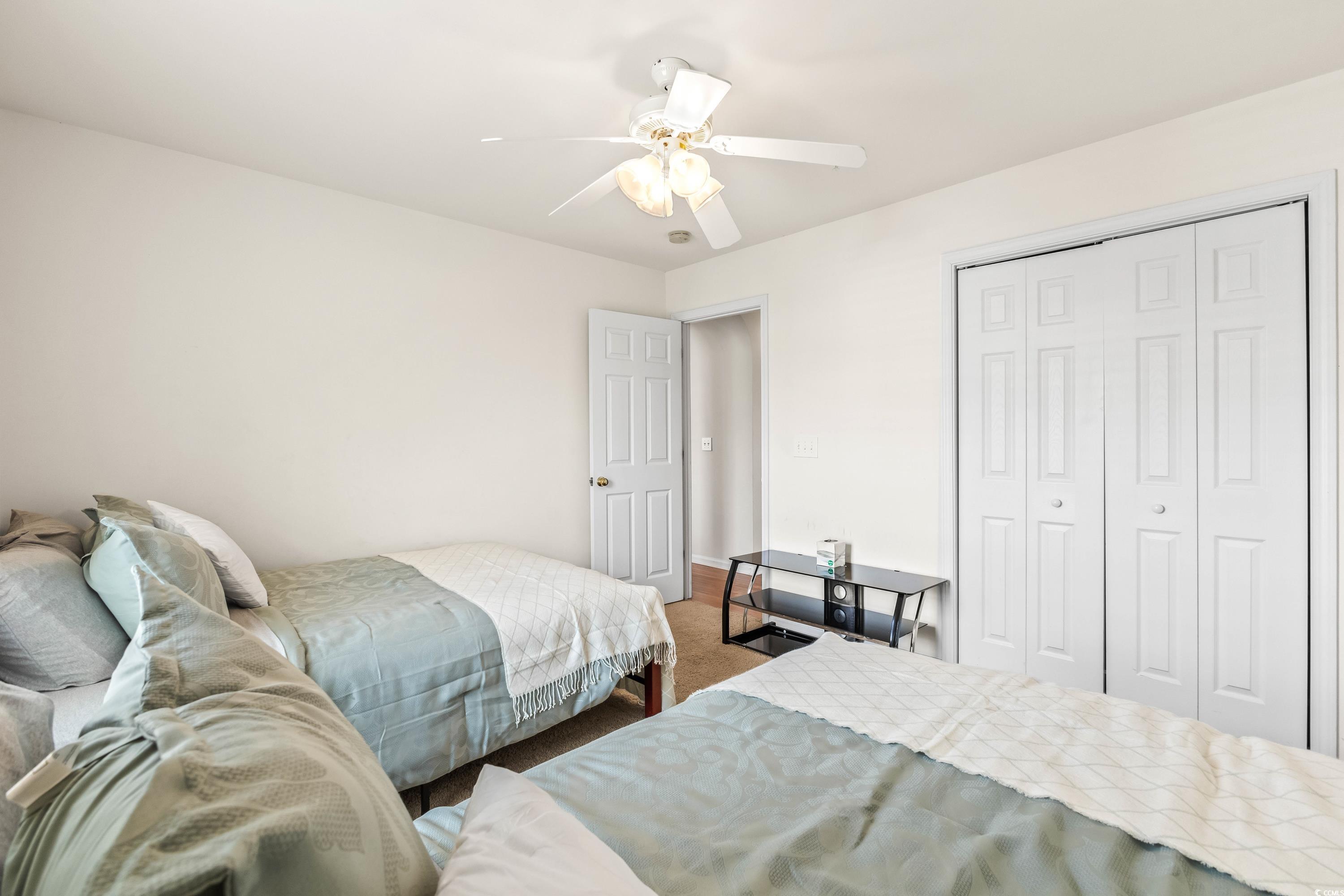 400 Black Smith Lane, Unit A Myrtle Beach, SC 29579 - Photo 28 of 35 Bedroom with carpet floors, a closet, and ceiling fan