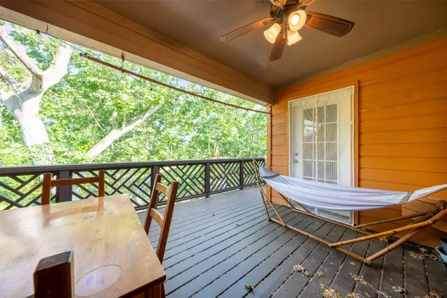 a view of a swimming pool with seating space