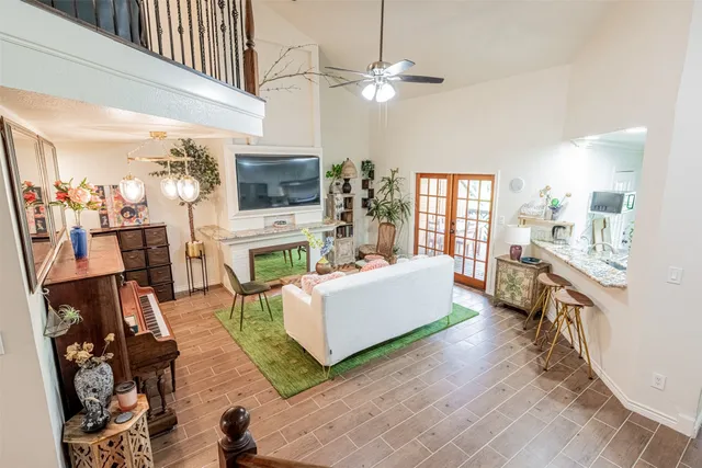 a living room with fireplace furniture and a flat screen tv