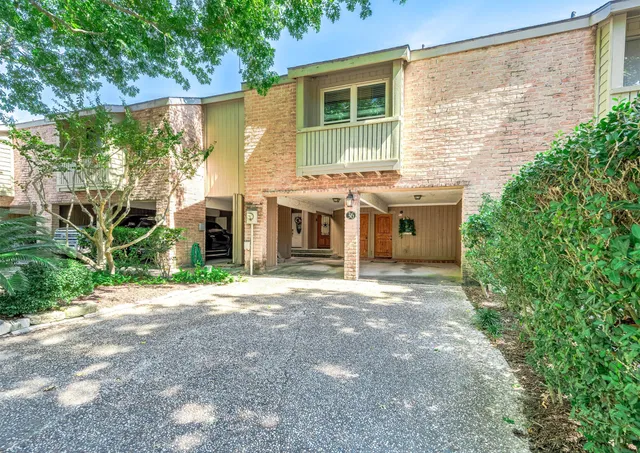 a front view of a house with a garden and outdoor space