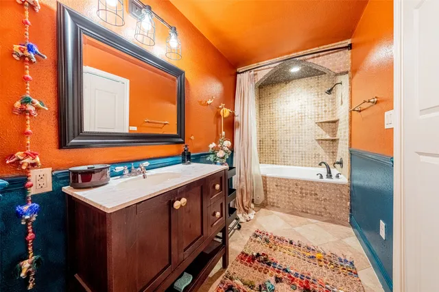 a bathroom with a sink and a mirror