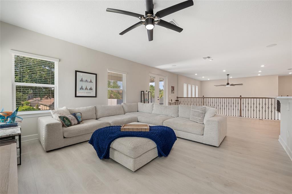 10175 Brocksport Circle Gotha, FL 34734 - Photo 34 of 54 a living room with furniture and a large window