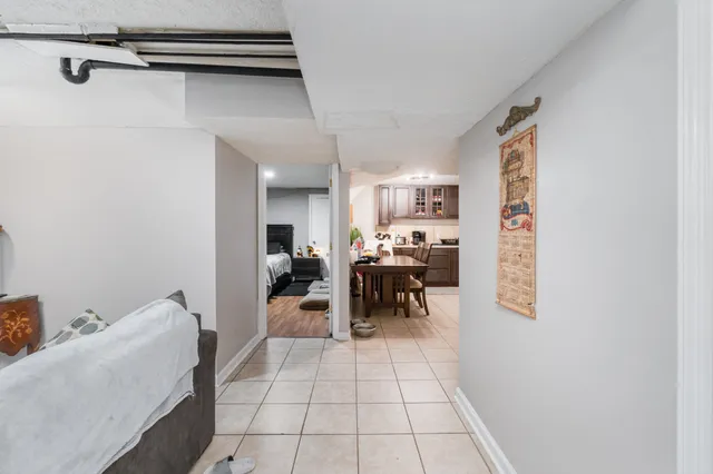 a view of a hallway with couch and a window