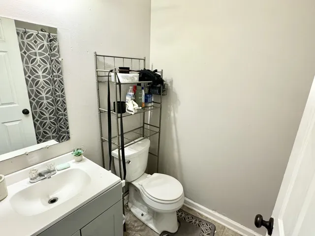 a bathroom with a sink and toilet