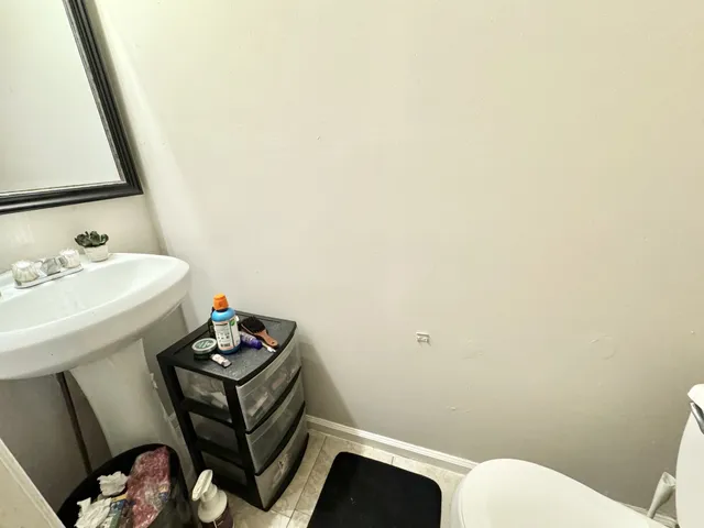 a bathroom with a sink a toilet and vanity