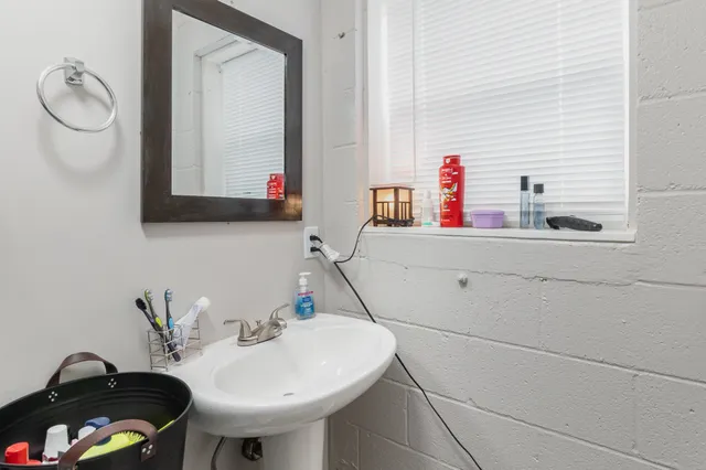 a bathroom with a sink and a mirror