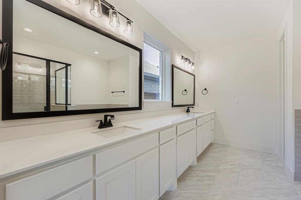 1841 Pk Vista Way Midlothian, TX 76065 - Photo 12 of 28 a bathroom with a double vanity sink and mirror
